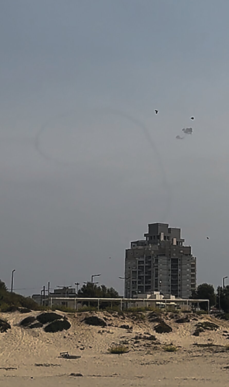 Rockets bursting in air: Israel’s Iron Dome missile defense system shoots down a rocket above Ashkelon, Israel, that was launched by Hamas from the Gaza Strip on Oct. 28.